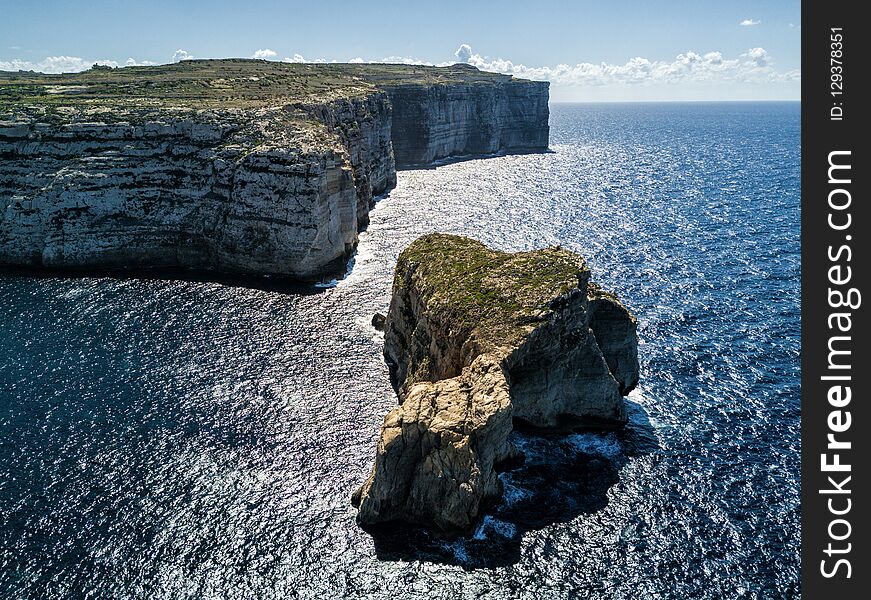 Aerial drone photo - Rugged coastline of the island of Gozo, Malta. Aerial drone photo - Rugged coastline of the island of Gozo, Malta