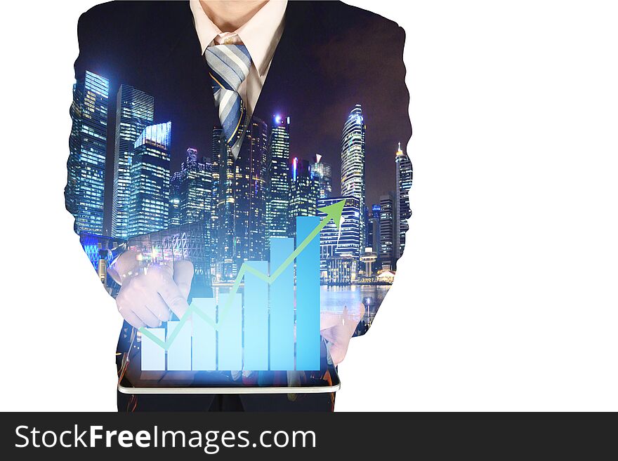 Double Exposure Of Businessman Using Tablet With Growth Financial Graph Chart And Building Background.