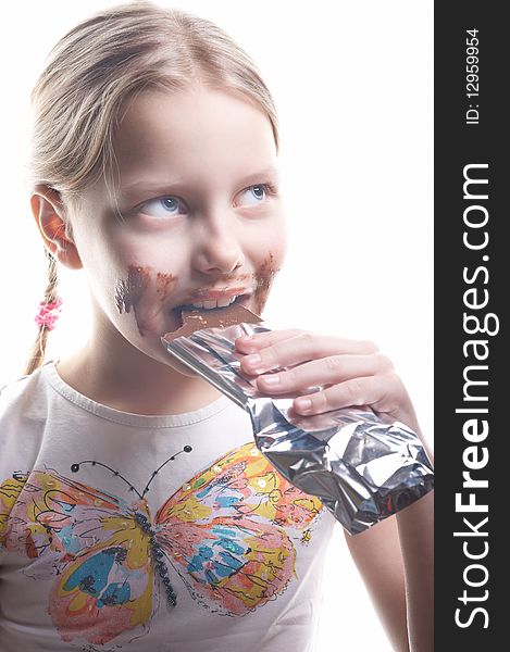 Little girl with chocolate on isolated white background