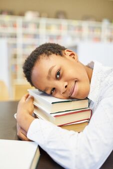 Student Is Leaning On His Books Royalty Free Stock Image