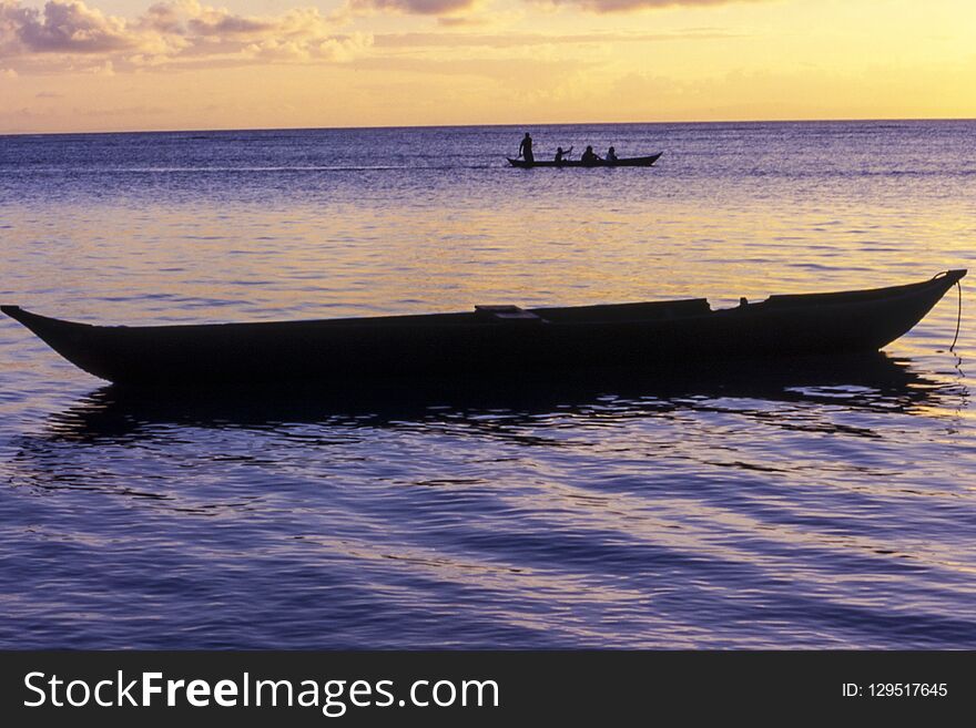 Pirogue At The Sunset