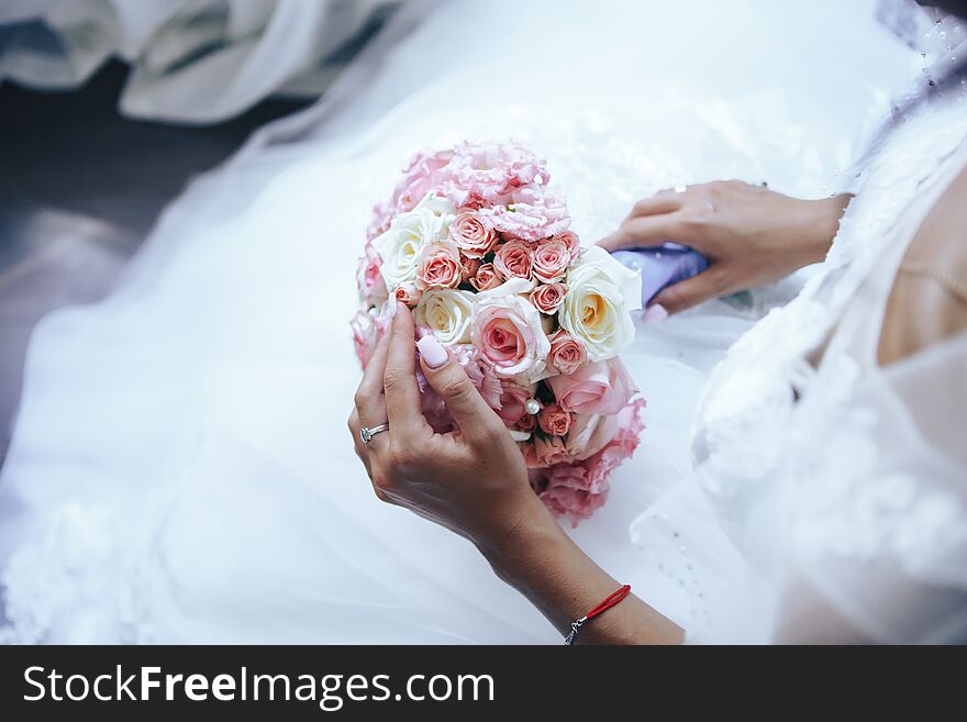 The Bride Holds A Wedding Bouquet. Close-up