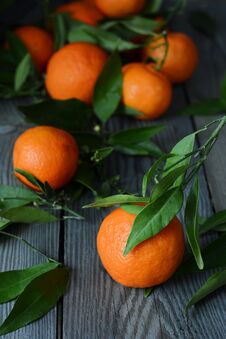 Tangerines Oranges, Mandarins, Clementines, Citrus Fruits With Leaves In Basket On Gray Background. Mandarin Oranges Royalty Free Stock Photo