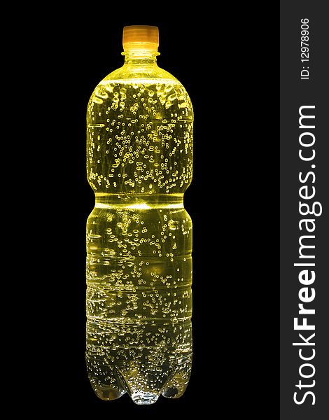 Plastic bottle with yellow lemonade and set of vials bubbles of gas. Isolated on black. Plastic bottle with yellow lemonade and set of vials bubbles of gas. Isolated on black.