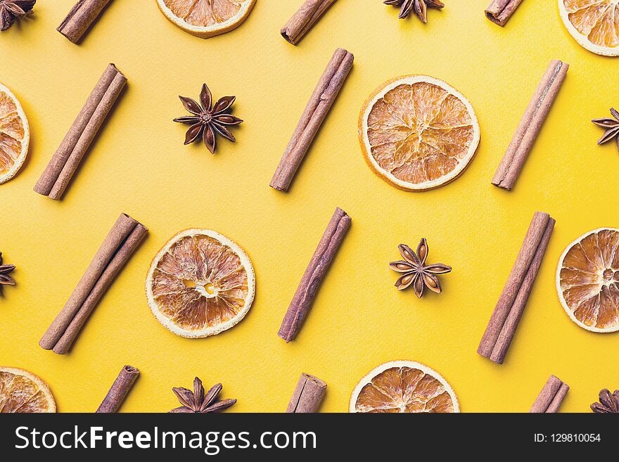 Spices or Mulled wine ingredients on yellow background. Top view, flat lay. Copy space for your text.