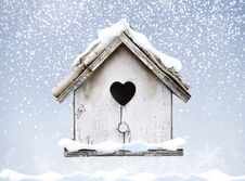 White Wooden Bird House Winter Snow Falling Down On Roof Heart S Royalty Free Stock Photography