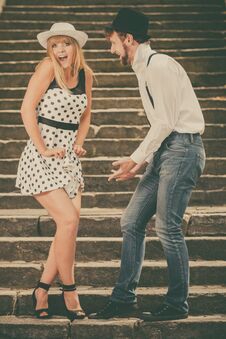 Loving Couple Retro Style Flirting On Stairs Royalty Free Stock Images