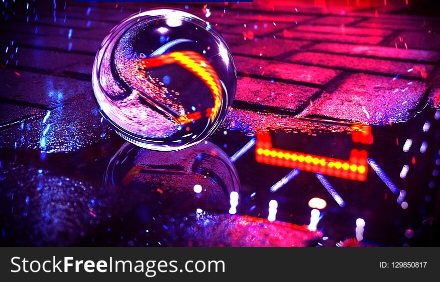 Background of wet asphalt with neon light. Reflection of neon lights in puddles, bright colors, glass ball.