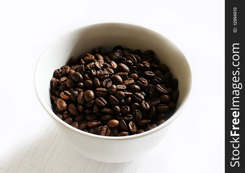 Macro shot of coffee beans in a cup