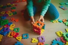 Little Girl Learning Numbers Play With Puzzle Stock Photography