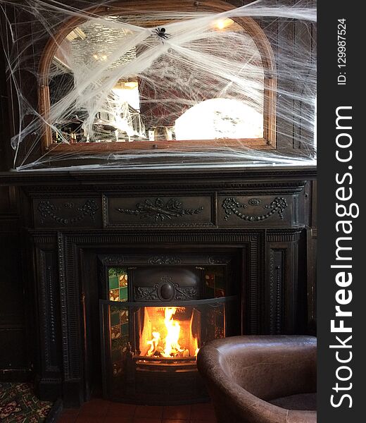 A fire place Halloween style in a pub