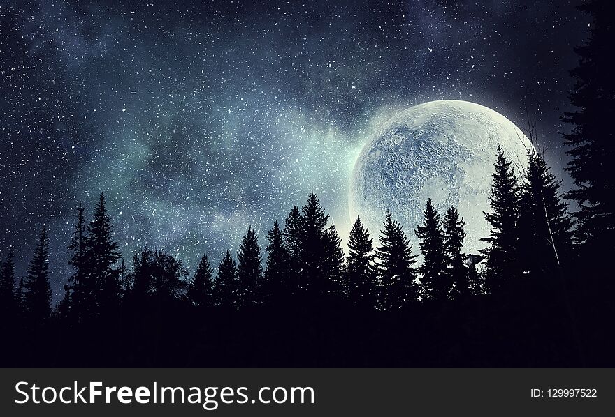 Beautiful full moon and silhouette of forest. Beautiful full moon and silhouette of forest