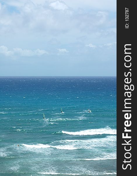 Windsurfers take off at the famed Diamond Head Beach. Windsurfers take off at the famed Diamond Head Beach