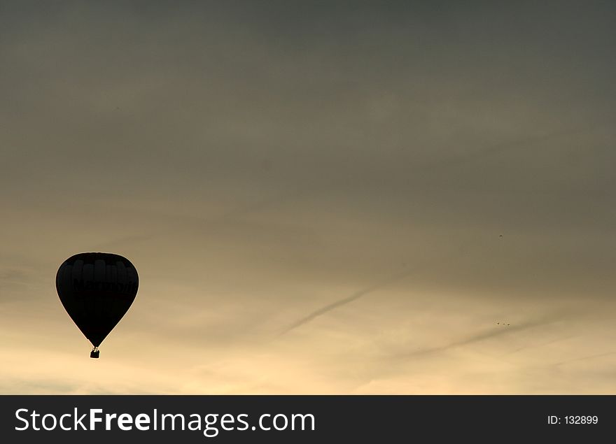 Silhouette of a hot air balloon at sunset