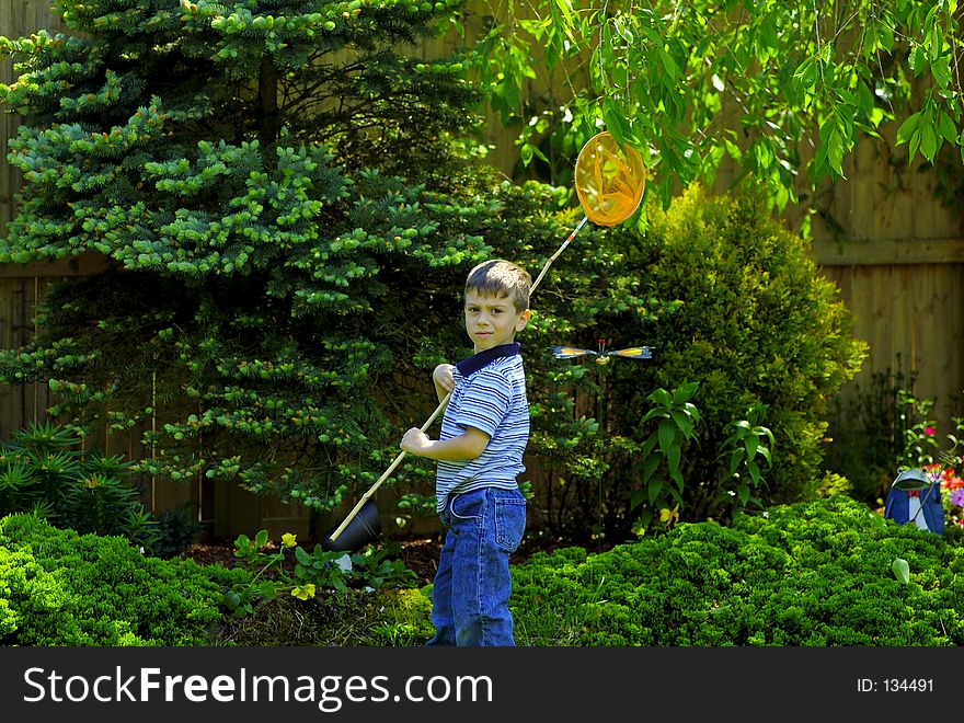 Young Boy Outside With Bug Net. Young Boy Outside With Bug Net