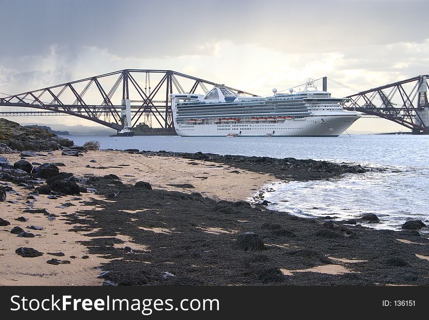 Golden Princess Moored in front of the Forth Rail Bridge, South Queensferry, Edinburgh, Scotland. Golden Princess Moored in front of the Forth Rail Bridge, South Queensferry, Edinburgh, Scotland.