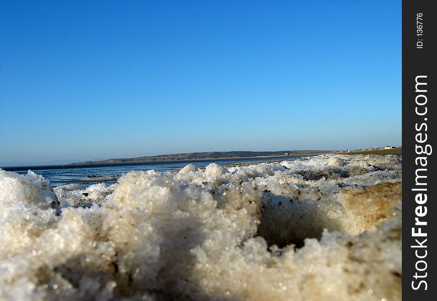 Close up of ice on beach in winter, the tide is out. Close up of ice on beach in winter, the tide is out.
