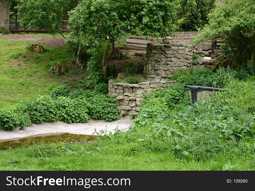 Beautiful green countryside, with stream and wall. Beautiful green countryside, with stream and wall