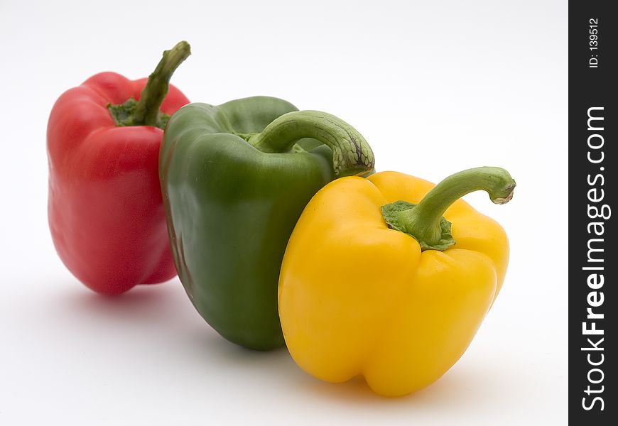 Close up of yellow green and red pepper