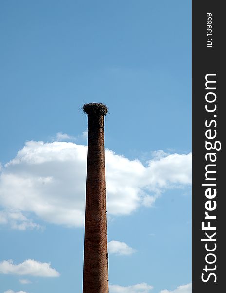 Stork nest in a old factory chimney