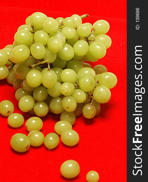 Grapes on red background
