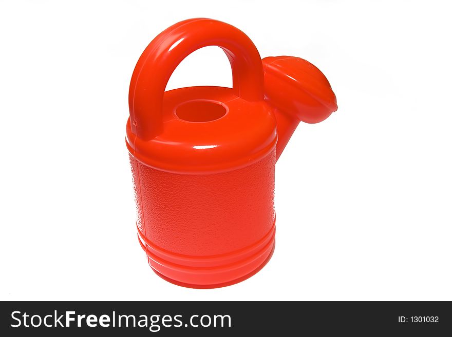 Brightly red watering-can on a white background