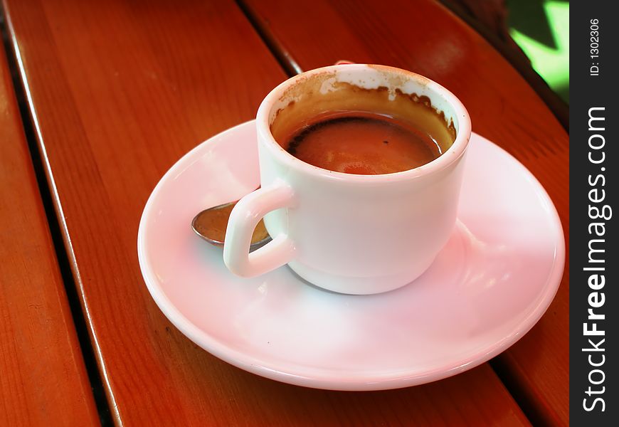 Cup of espresso on wooden table. Cup of espresso on wooden table