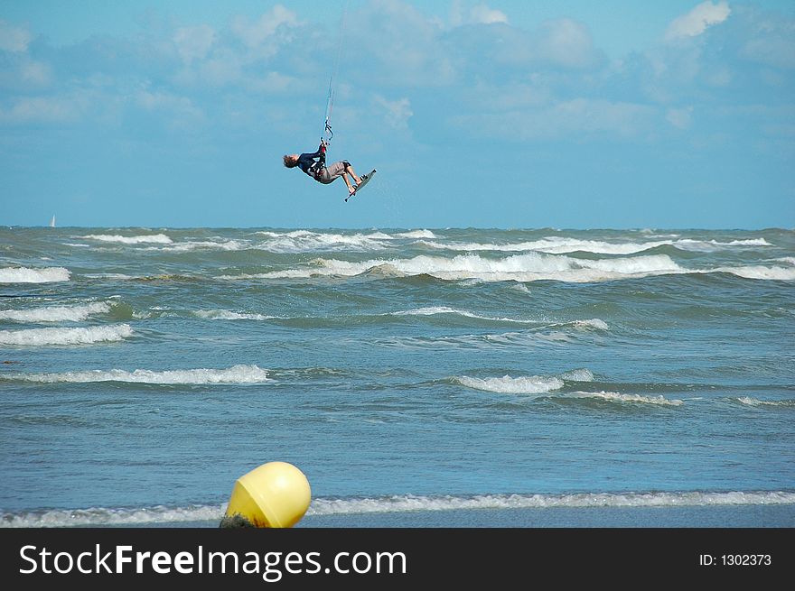 Kitesurfer making a jump, north sea,belgium. Kitesurfer making a jump, north sea,belgium