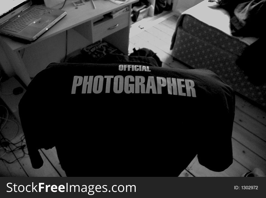 The Official Photographer Shirt on a chair need a desk. The Official Photographer Shirt on a chair need a desk.