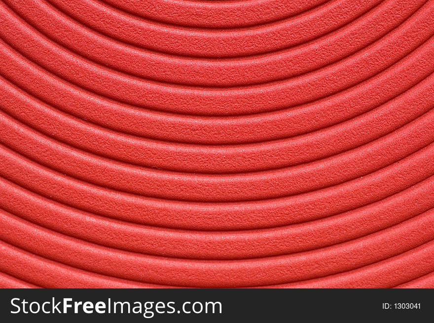 Close up of a red spiral background.