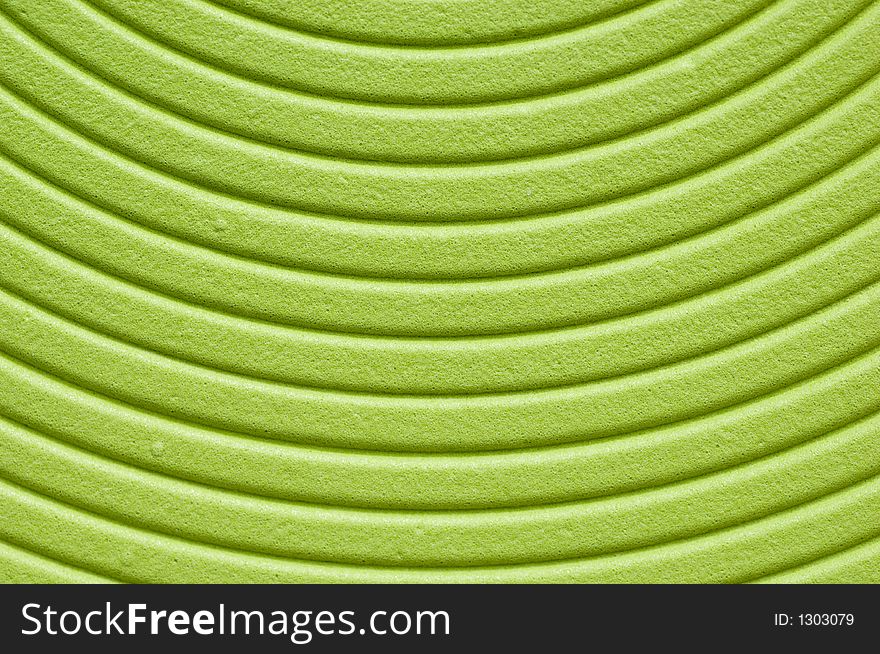 Close up of a green spiral background.