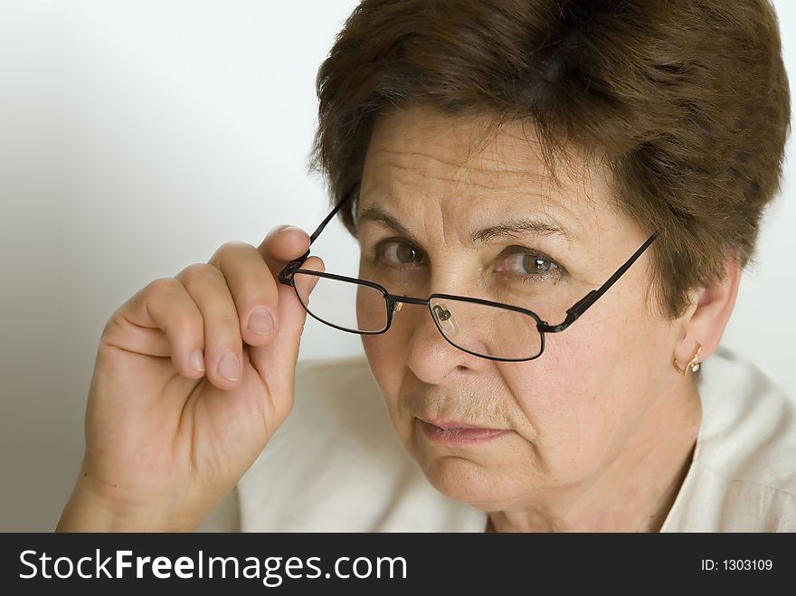 Woman in the office with the eyeglasses