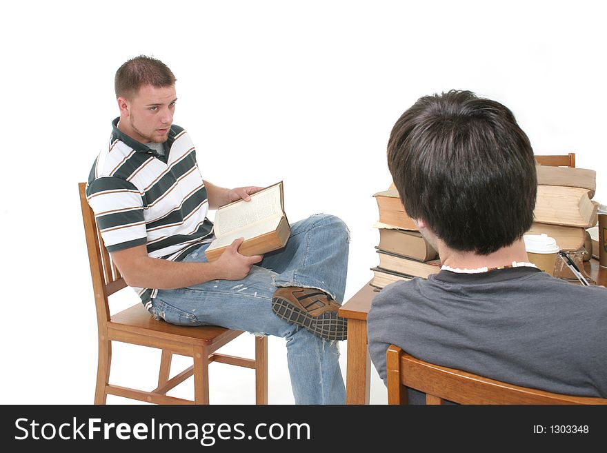 Two young men studying at a table. Two young men studying at a table