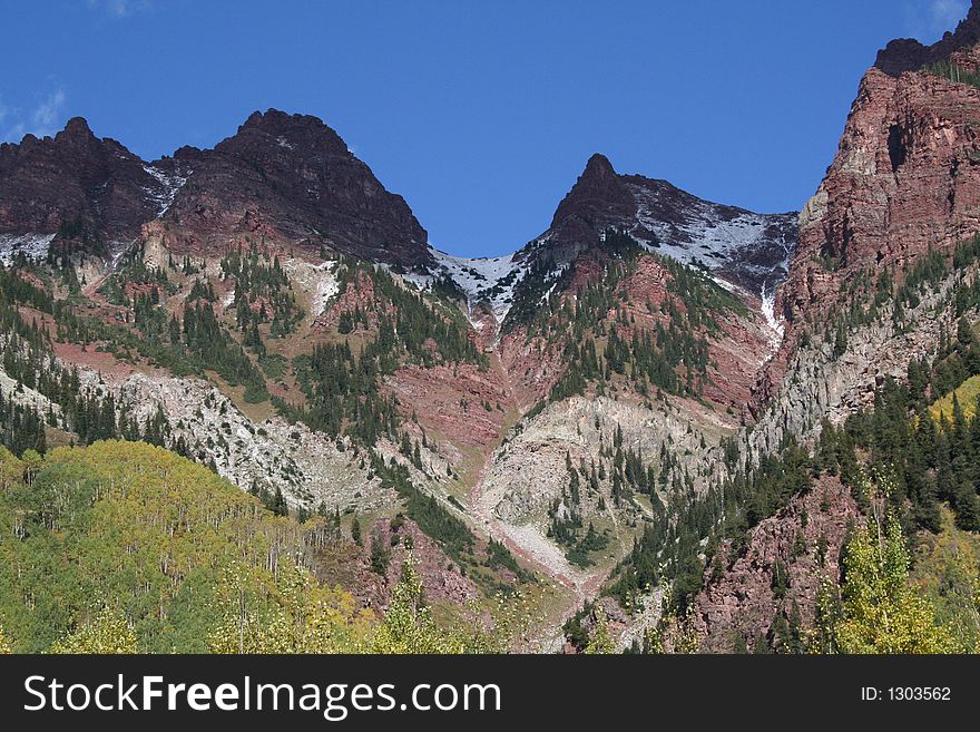 Peaks in red mountains with sparse snow. Peaks in red mountains with sparse snow