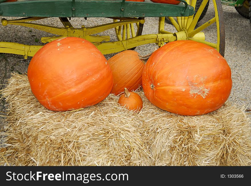 Photo of Pumpkins on a Bale of Hay