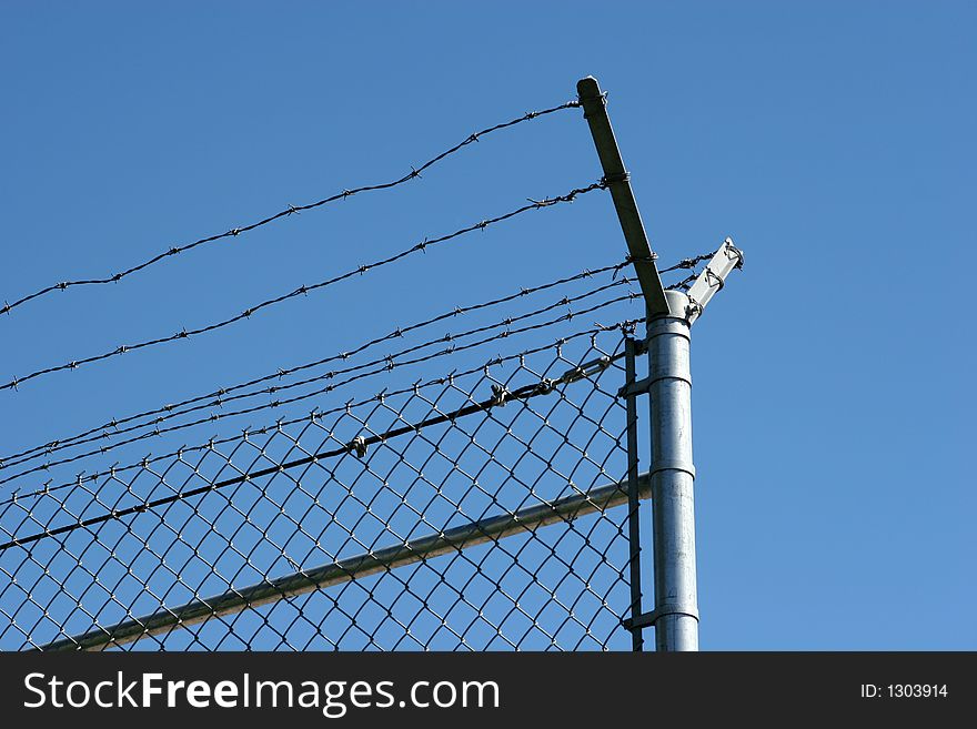 Security fence and barbed wire