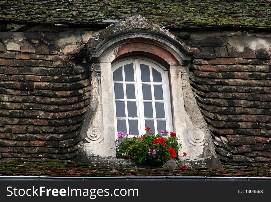 Beaune / Cote d'or France old roof an window. Beaune / Cote d'or France old roof an window