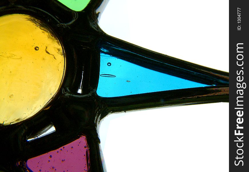 Enlarged section of a suncatcher showing 4 colours of glass. Enlarged section of a suncatcher showing 4 colours of glass