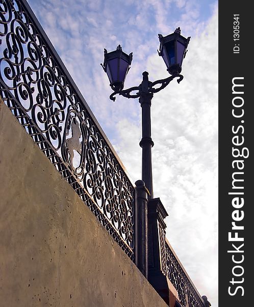 Being single lantern on a bridge at midday