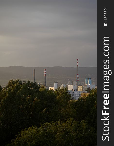 Industrial area - factory surrounded by trees.