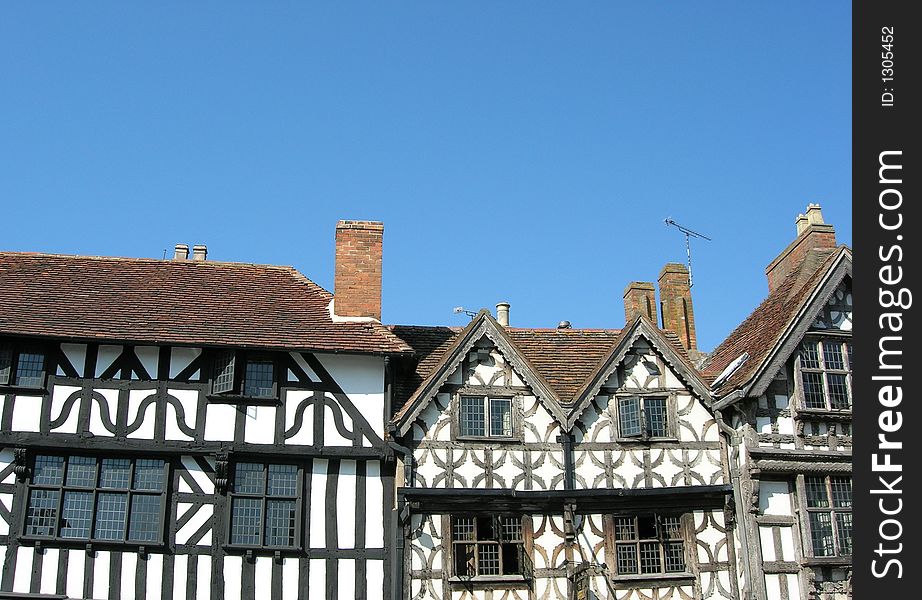 Elizabethan timber framed houses against blue sky. Elizabethan timber framed houses against blue sky