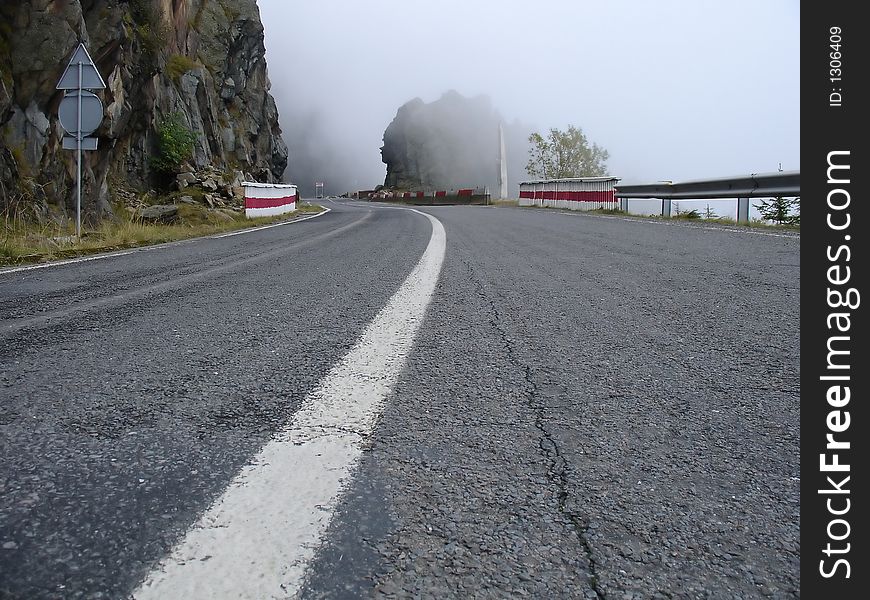 Mountain road through clouds in fagaras mountains