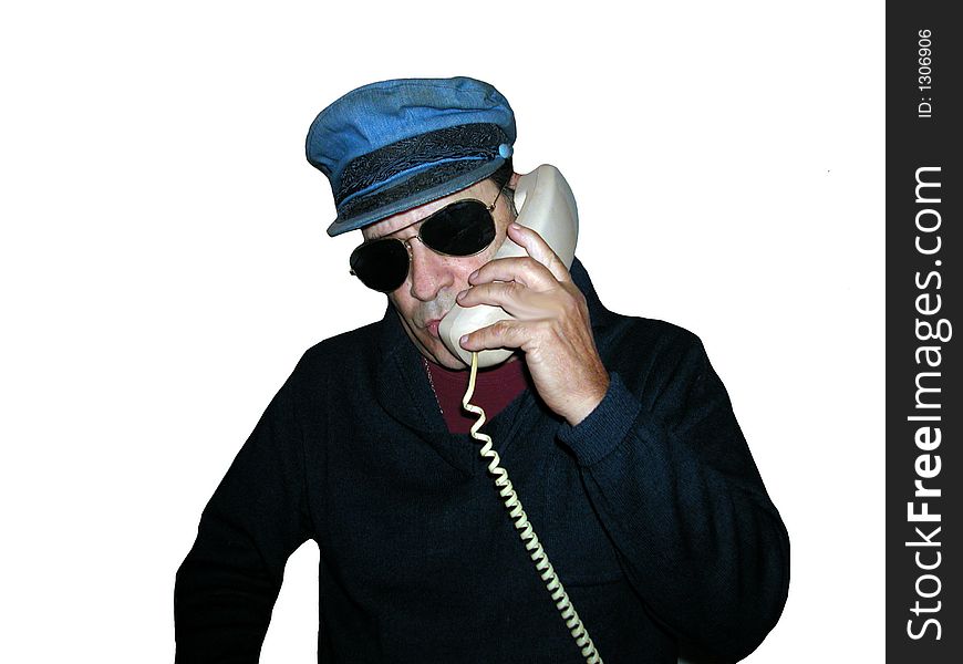 Man wearing a blue hat and sunglasses talking on the phone,over white. Man wearing a blue hat and sunglasses talking on the phone,over white