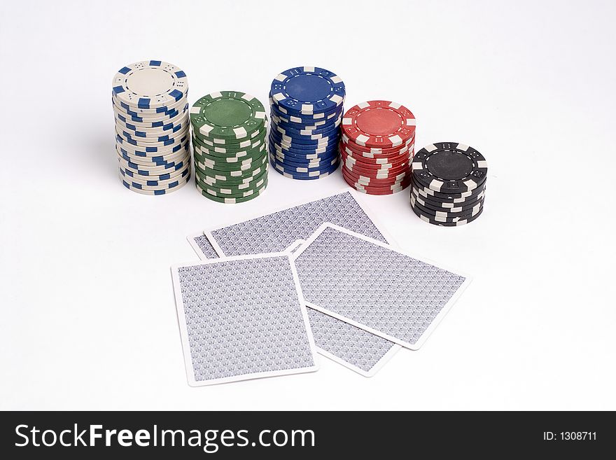 Folding poker hand with chips.