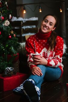Marhsmallow And Gifts With Beautiful Girl Near Christmas Tree. Royalty Free Stock Photos