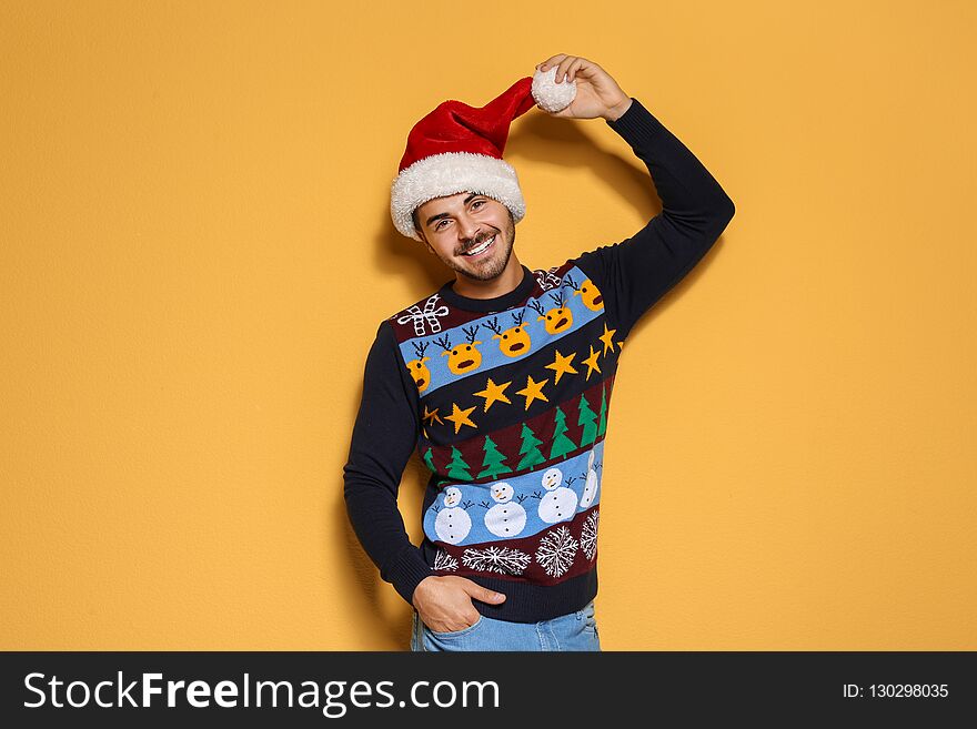 Young man in Christmas sweater and hat
