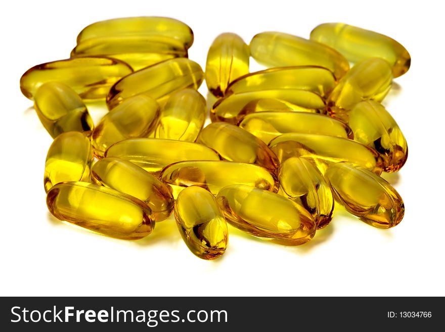 Golden capsules of a pill with medicinal oil. Golden capsules of a pill with medicinal oil.