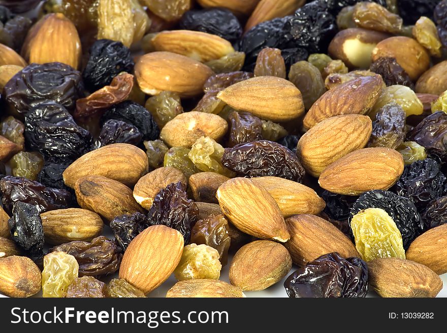 Mix of almond nuts and raisin close-up.
