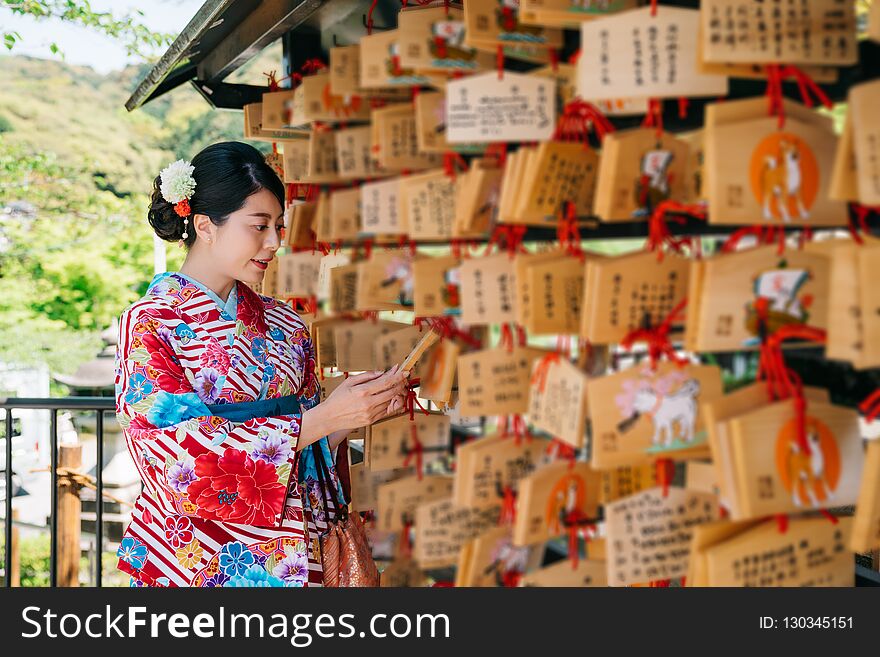 Japanese Lady Looking At The Wooden Board