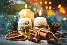 Merry Christmas And Happy New Year. Candle And Christmas Toys On A Wooden Table. Bokeh. Selective Focus. Stock Image Merry Christmas And Happy New Year. Candle And Christmas Toys On A Wooden Table. Bokeh. Selective Focus. Stock Image